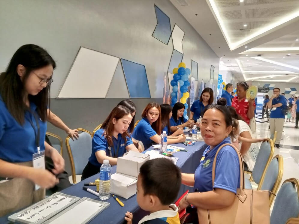 Securing her son’s future: Christine Caberte takes a significant step toward building her son's financial independence by opening a BDO Junior Savers account during the BDO Fiesta in Bacolod./ Photo from BDO