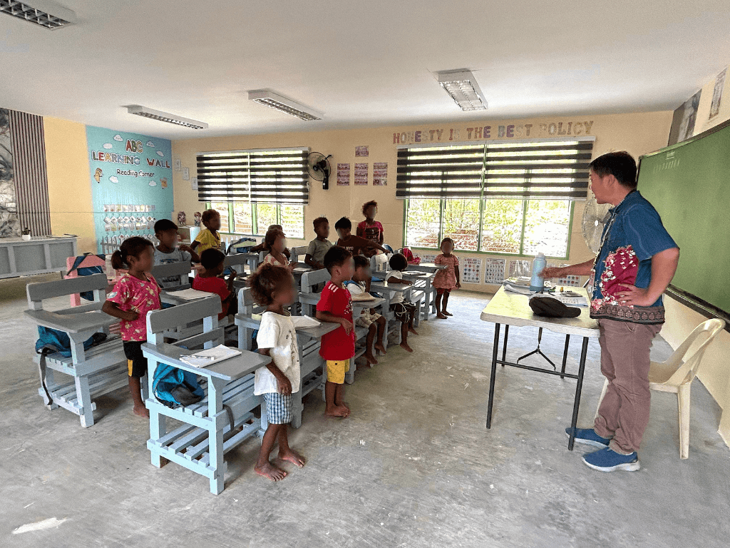 Dumagat students attend classes inside a newly refurbished classroom at Mabaldog Elementary School. Through the AuroraPH project, this last-mile school is now equipped with more stable electricity, industrial fans, a Smart TV, and internet connection &ndash; providing a conducive, digitally connected learning environment for around 40 learners.| Contributed photo