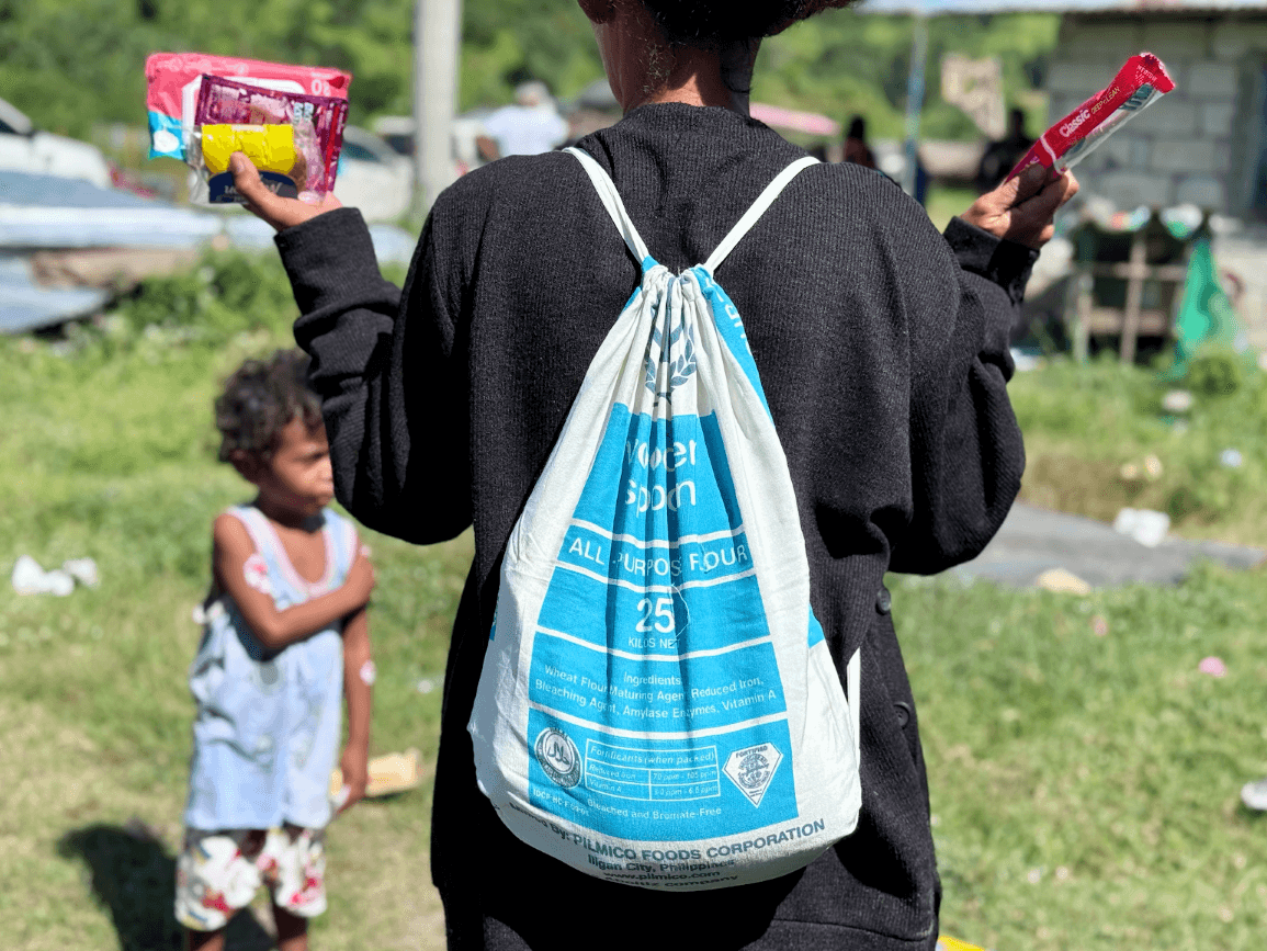 Shown in the photo is a repurposed cotton flour sack used as a drawstring bag during a community outreach activity — an example of how Aboitiz Foods gives new life to packaging materials./ Contributed photo
