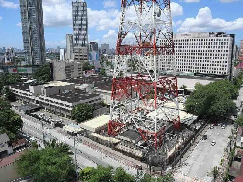 The 220-meter Millennium Transmitter remains standing over the ABS-CBN compound in Quezon City as the media company consolidates its operations. ABS-CBN expects to turn over the property sold to Ayala Land by mid-2027.
