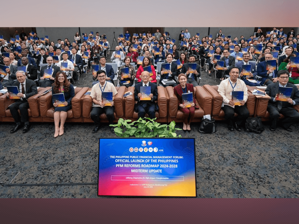 ADB President Masato Kanda (seated, center) with ADB staff during the launch of the Philippines PFM Reforms Roadmap update. | Photo from the ADB