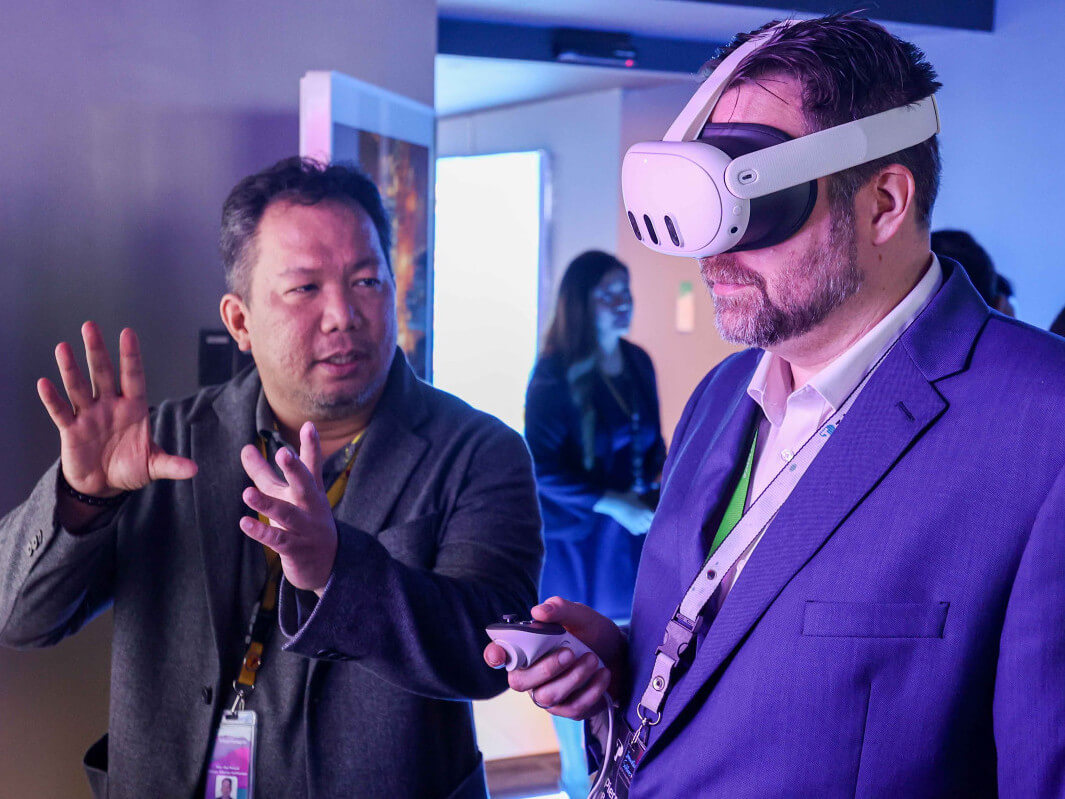 Pierre Berube, Teleperformance senior vice president of shared services & capability development, tries out the immersive virtual reality set upfeatured during the opening of Teleperformance’s newest Innovation & Solutions Hub in Taguig./ Contributed photo