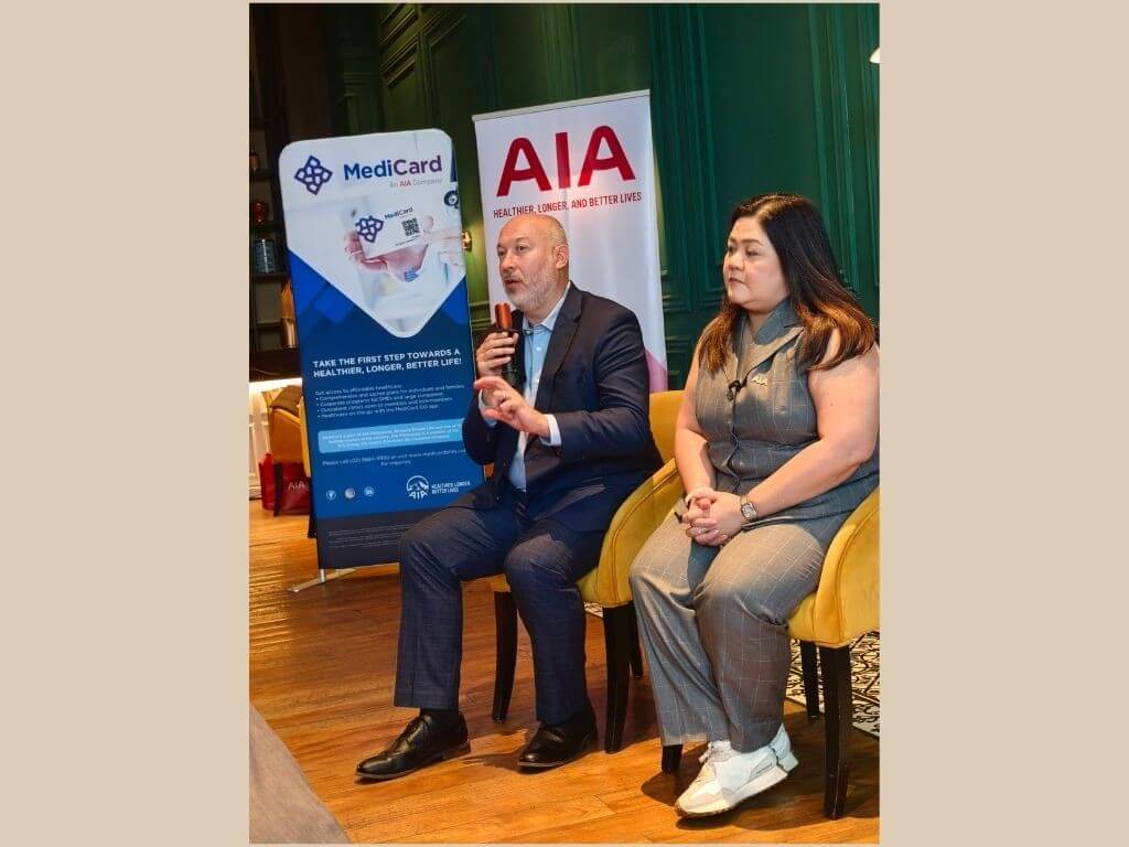MediCard chief executive officer Julian Mengual and AIA Philippines chief marketing officer Melissa Henson during the launch of Group Life + HMO, an employee benefits solution that combines health maintenance organization coverage with life insurance and disability protection. | Photo by Vanessa Hidalgo