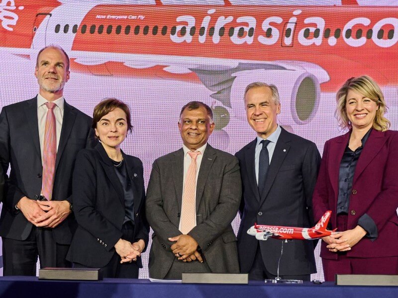 Marking the announcement of AirAsia X&rsquo;s historic order for 150 Airbus A220 aircraft at Airbus&rsquo; facility in Mirabel, Canada are (L-R) Lars Wagner, CEO of Airbus Commercial Aircraft; Quebec Premier Christine Frechette; Tan Sri Tony Fernandes, CEO of Capital A and advisor to AirAsia X; Canadian Prime Minister Mark Carney; and Melanie Joly, Canada&rsquo;s Minister of Industry and Minister responsible for Canada Economic Development for Quebec Regions. | Contributed photo