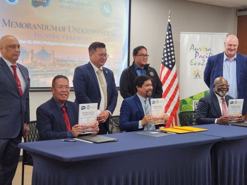 LNG POWER PROJECT. Seated from left: SC Megaworld Construction and Development Corp. president Engr. Hector S. Sanchez; APECO president and CEO Undersecretary Gil G. Taway IV; and ARQ Development managing partner Barry Adedamola lead the signing of a memorandum of understanding for the proposed LNG-based power generation and substation project at the Philippine Consulate General in Houston, Texas, on Oct. 26, 2026. Philippine Consul General Gunther Emil M. Sales (standing, third from left) welcomed the delegation. | ​Contributed photo