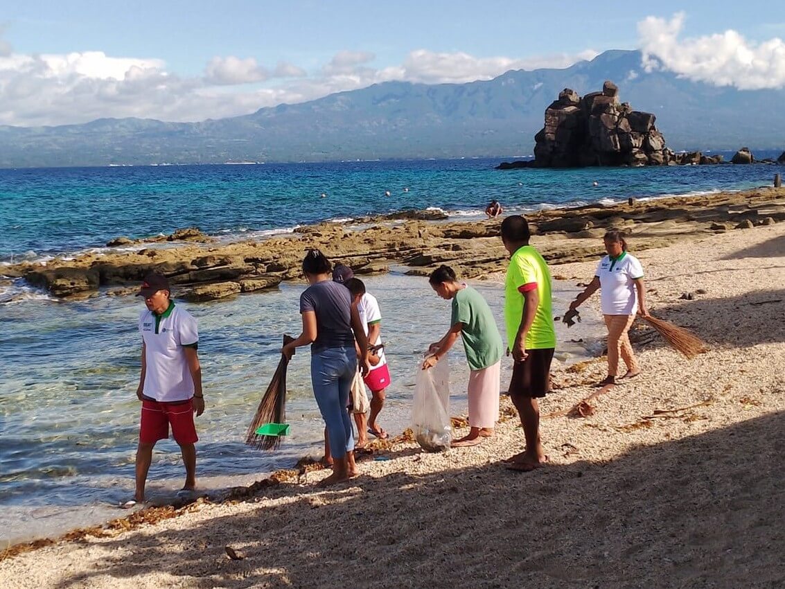 Community members take part in the regular cleaning and maintenance of Apo Island, a shared responsibility that helps keep its coastal and marine habitats healthy for both wildlife and visitors. Stewardship here extends beyond protecting sea turtles; it includes caring for the island that sustains the community's livelihood. | Photo from Apo Island Protected Landscape and Seascape (AIPLS)