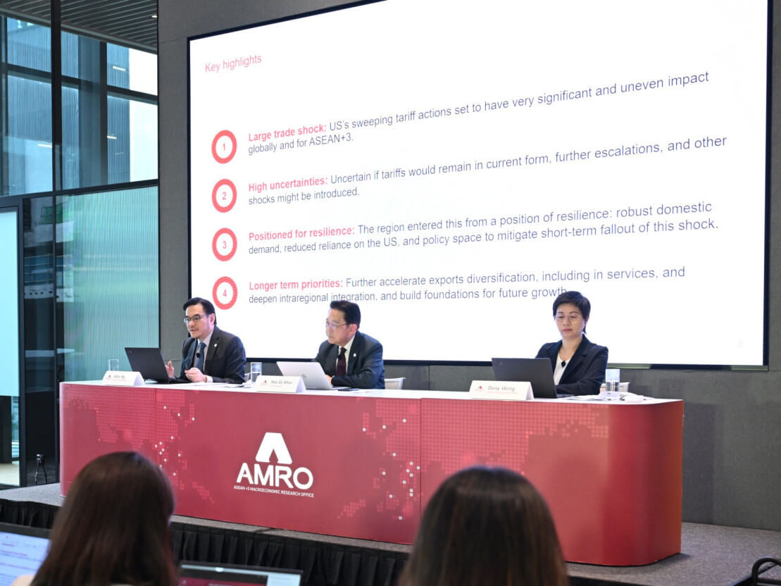 AMRO economists explain the think tank's latest economic outlook publication during a briefing last week./Contributed Photo