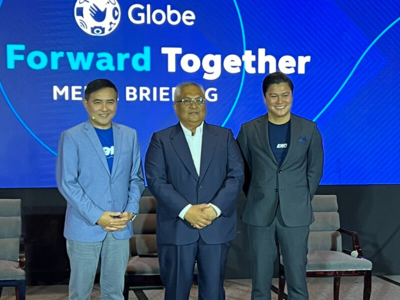 From left: Globe Vice President Chief Commercial Officer Darius Delgado, President and CEO Carl Raymond R. Cruz, and CFO Juan Carlo C. Puno pose for a photo after the company’s annual stockholders’ meeting on April 22./Photo by Miguel R. Camus 