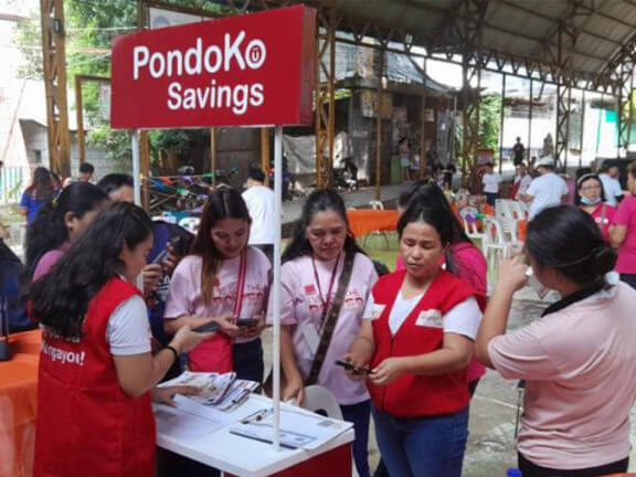 BanKoMares and BanKoPares assist sari-sari store owners as they open an account during a Hapinoy caravan in Quezon City./ Contributed photo