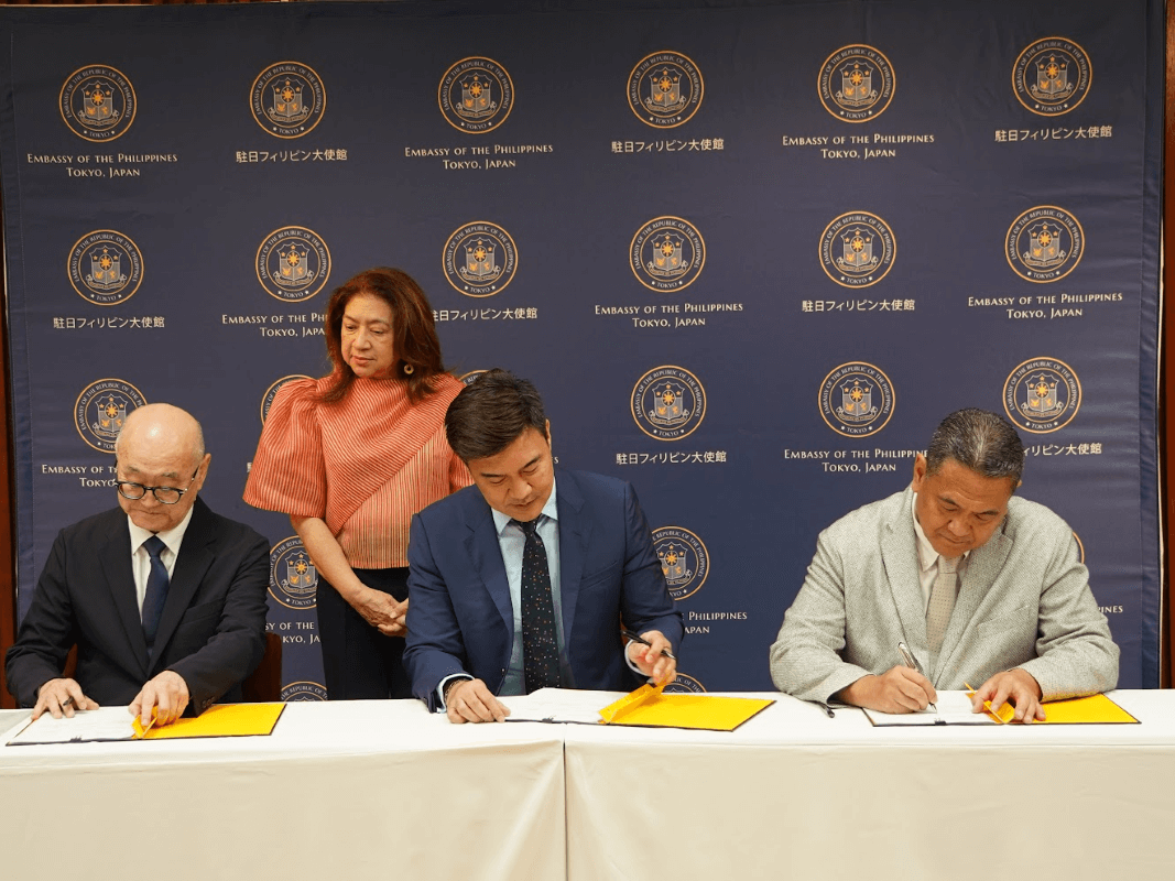 From left:  InfiniVAN president Shigeki Nakahara, Bases Conversion and Development Authority (BCDA) President and CEO Joshua M. Bingcang, and IPS Inc. president and CEO Koji Miyashita signed a memorandum of understanding to explore projects on the utilization of BCDA’s information and communications technology assets. The signing was witnessed by Philippine Ambassador to Japan Mylene De Joya Garcia-Albano. | Contributed photo