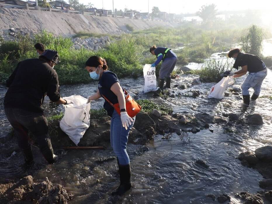 BCDA volunteers line up at dawn to fill straw bags with waste collected from the Abacan, River, in Angeles, Pampanga. | BCDA Photo
