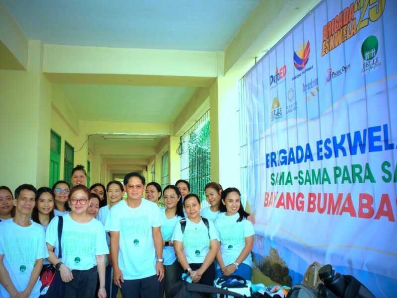 Belle Group volunteers, led by CEO Armin Raquel Santos (front row, 7th from left), beam after refurbishing Dau Elementary School in Mabalacat for Brigada Eskwela 2025./Photo from Belle 