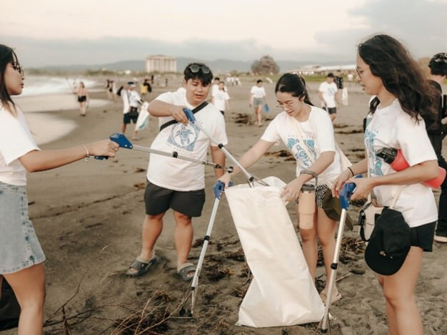Volunteers picking up trash during the beach cleanup./Contributed photo