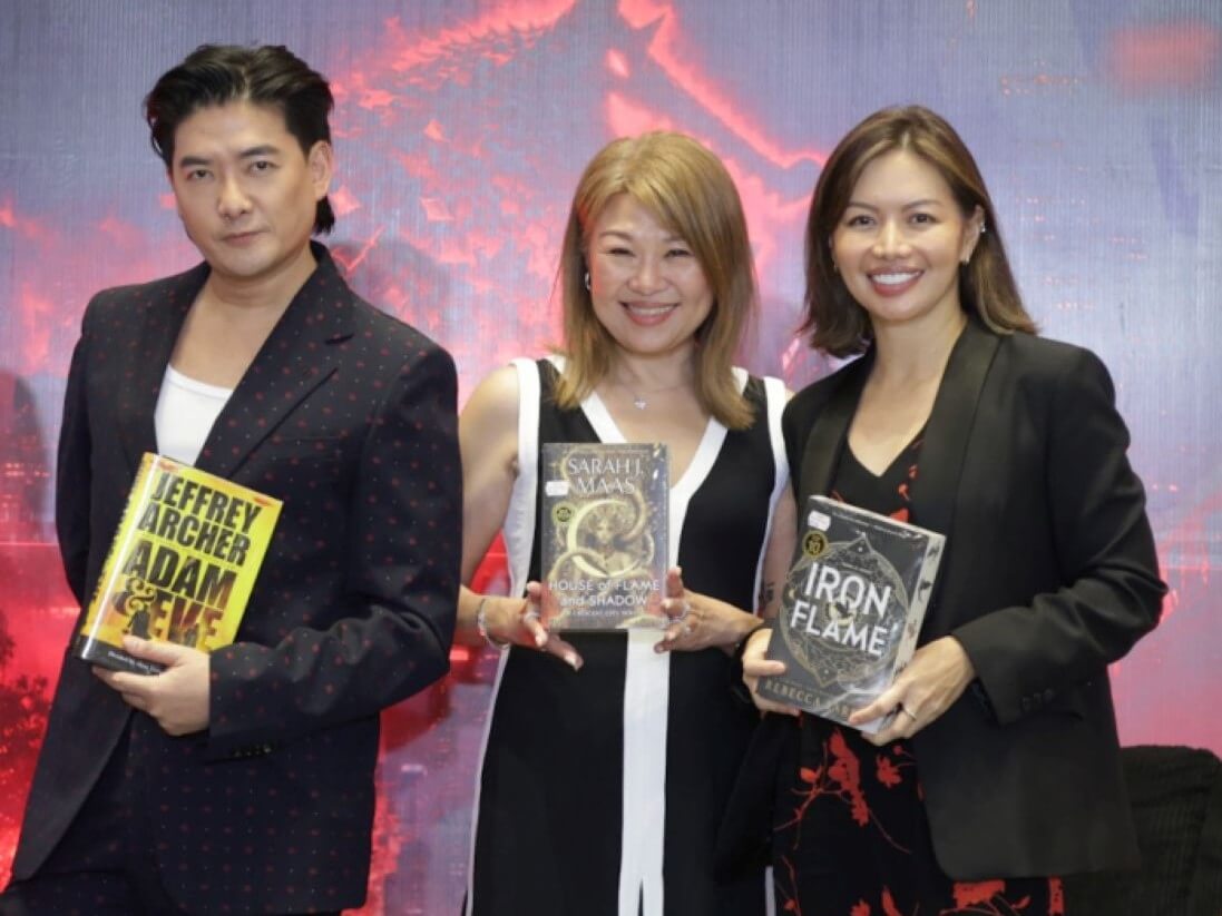 Big Bad Wolf Books founder and executive director Jacqueline Ng (center) &nbsp;joins partners Tim Yap and Charmaine Palermo as the company prepares to bring its discounted book sale to BGC for the first time. | Contributed photo