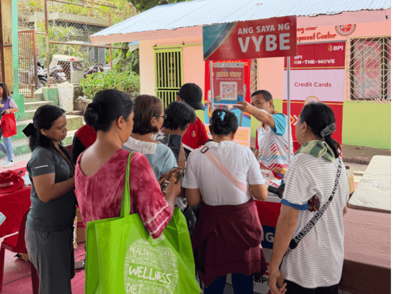 Participants explore BPI&rsquo;s financial services and register for the VYBE digital banking platform during the &ldquo;Basta Babae, Wais!&rdquo; financial literacy event in Caloocan City. | Contributed photo