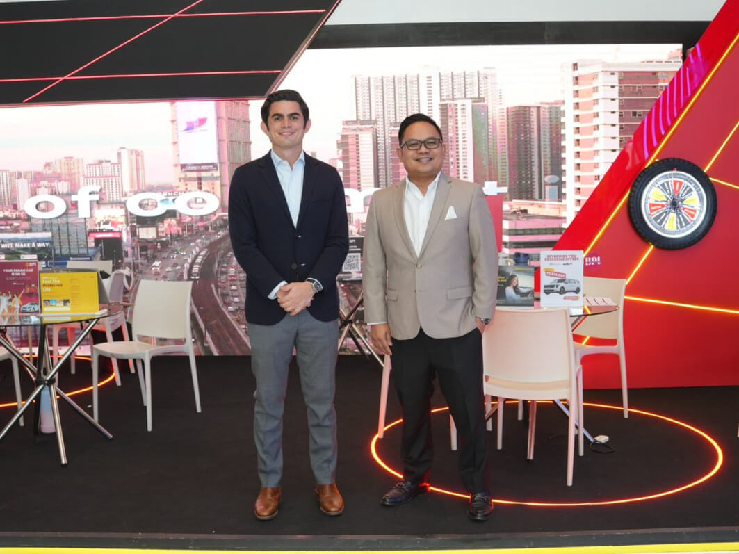 Jaime Alfonso Zobel De Ayala, AC Mobility president and CEO with Dexter Cuajotor, BPI’s head for retail lending and bancasurance group at BPI’s Booth at Manila International Auto Show 2025 in Manila World Trade Center./ Photo from BPI