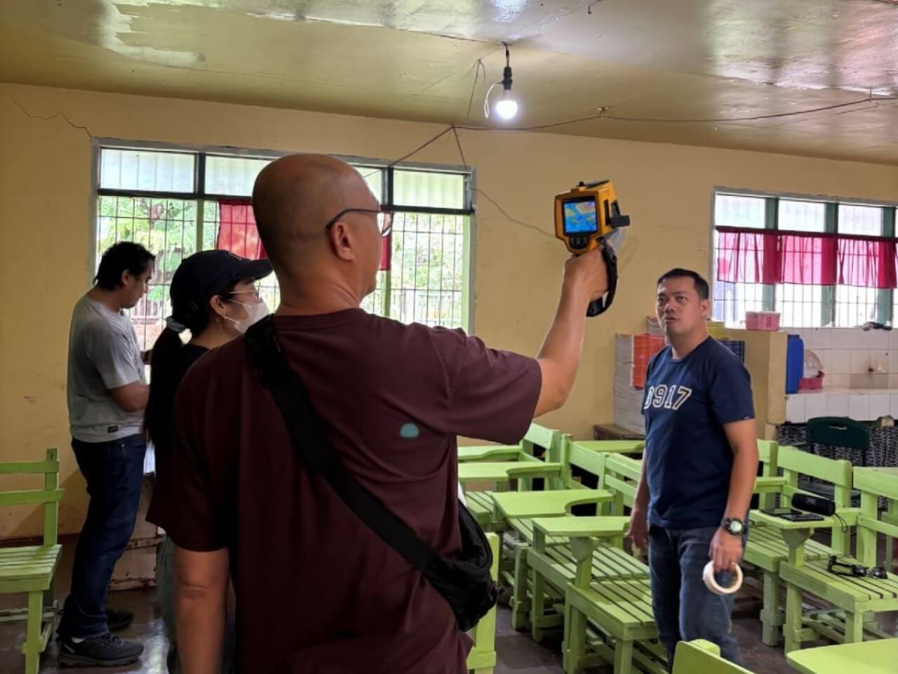 Jay Bosi, an engineer from Globe, inspects classrooms at the Pedro “Oloy” N. Roa Sr. Elementary School in Cagayan de Oro City./ Contributed photo