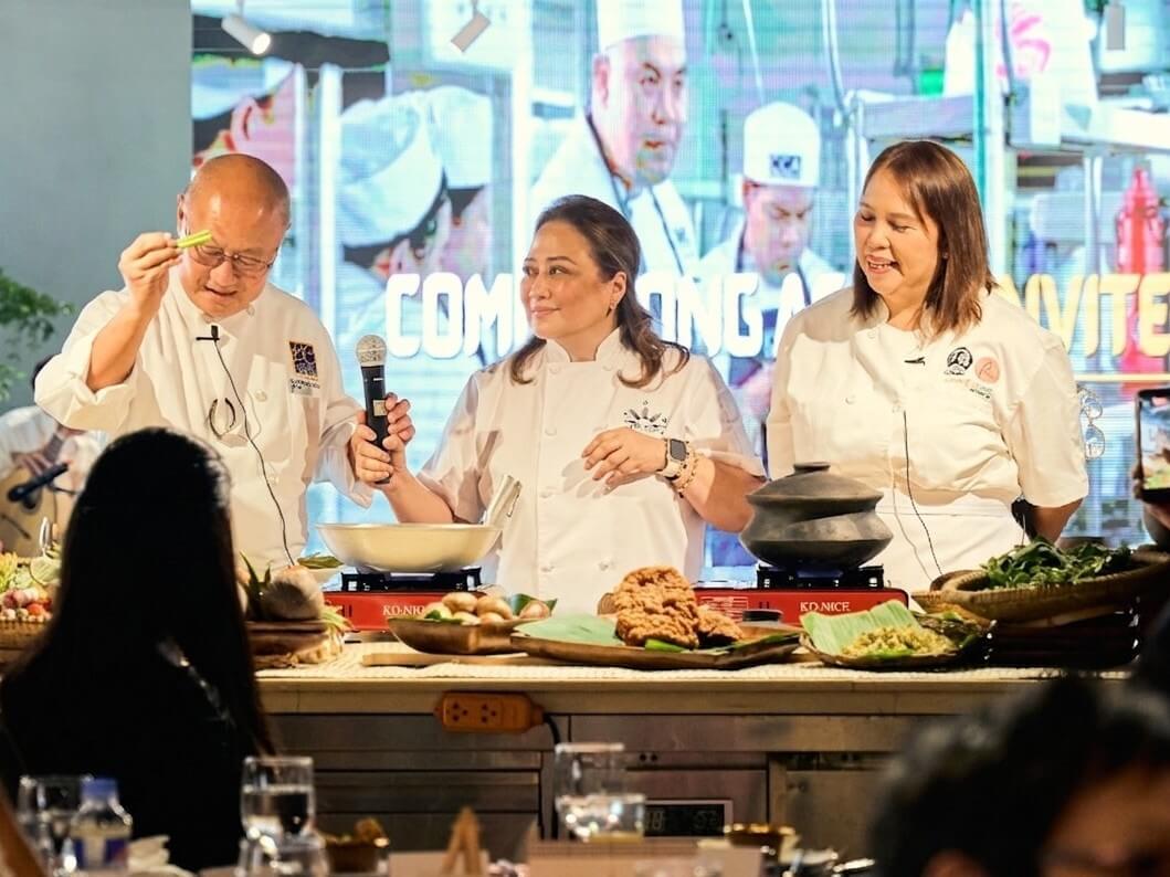 Chef Reggie Aspiras leads a live cooking demonstration with Chef Nic Rodriguez of BistroCandon and Chef Pam Aragoza of La Preciosa during the Philippine Heritage Kitchen launch, highlighting heirloom recipes, regional Filipino flavors, and the rich traditions behind the country&rsquo;s culinary heritage. | Contributed photo