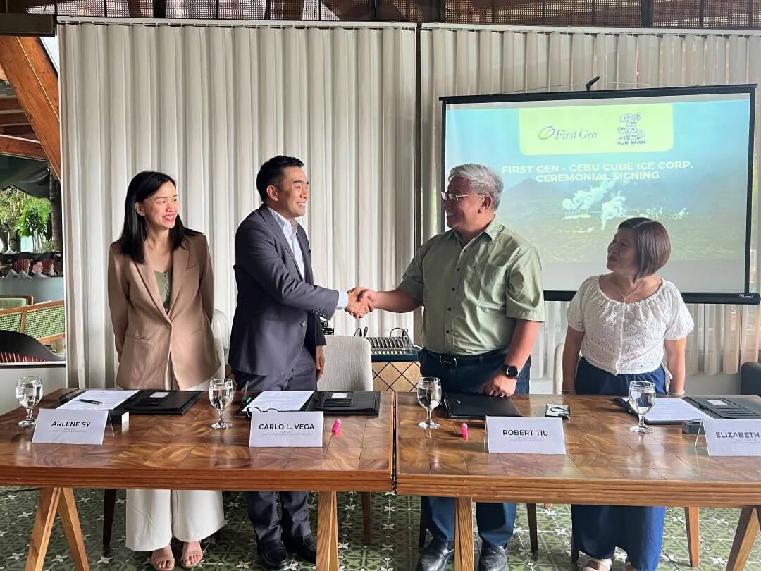  First Gen chief customer engagement officer Carlo Vega (second from left) and Cebu Cube Ice president and CEO Robert Tiu (third from left) shake hands after renewing an agreement for First Gen to supply Cebu Cube Ice with electricity from an RE source. With them are Arlene Sy (left), First Gen sales and marketing head and Elizabeth Tiu, Cebu Cube Ice chief financial officer./ Contributed photo