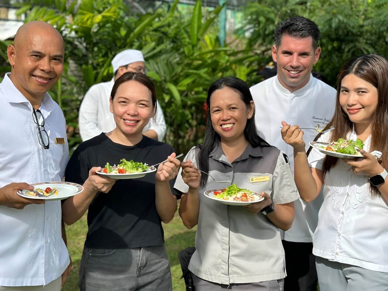 Shangri-La Mactan F&B staff enjoying salad made from produce grown in their hydroponics garden. | Contributed photo