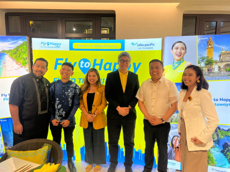 All smiles: Lao and Angeles pose with Dr. Karen Remo, founder and CEO of New Perspective Media (far right), and Romer Tesado of New Perspective Media (second from left)./Photo by Miguel R. Camus 