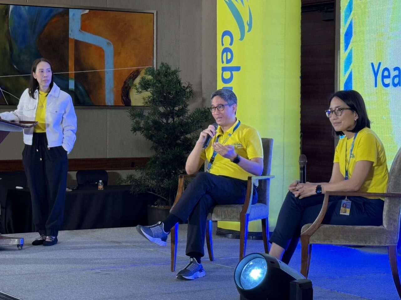 Cebu Pacific's chief commercial officer Xander Lao and marketing head Candice Iyog takes questions from the press during Tuesday's briefing while communications head Carmina Romero looks on./Photo by Daxim L. Lucas