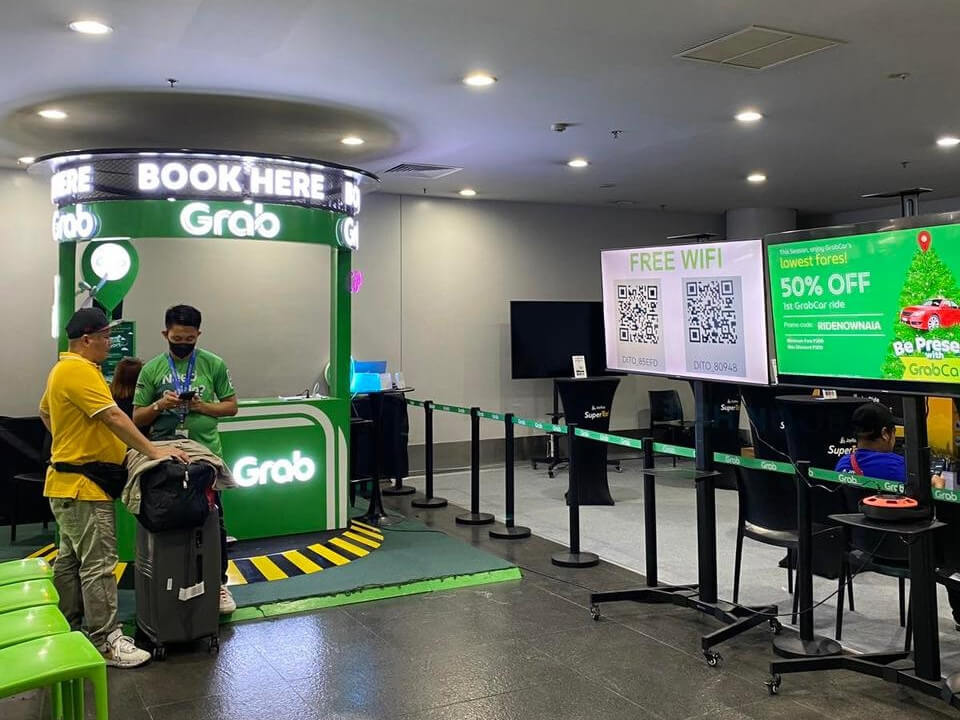 Grab Philippines' booking booth at NAIA Terminal 3 for passengers who don't have mobile phone access to the popular TNVS operator./Contributed Photo