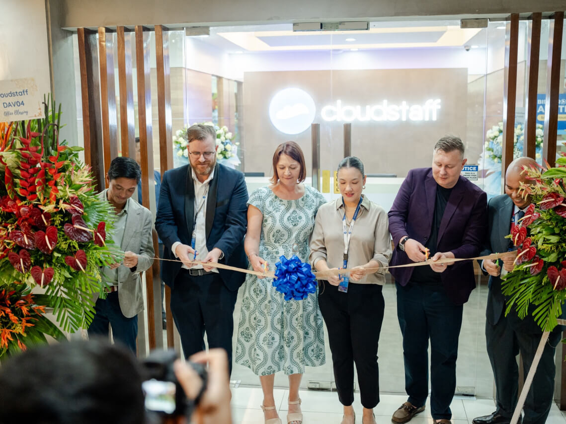 From left: Ricardo "Cary" Lagdameo, president of Damosa Land; Matthew Rutter, Cloudstaff SVP for client growth operations; Danielle Azzara, Cloudstaff client; Miki Carbonel, Cloudstaff global chief recruitment officer; Toby Longhurst, Cloudstaff director; and Midel Santos, Cloudstaff director for value and property cut the ribbon to signal the launch of the newest Cloudstaff center in Davao./Contributed photo
