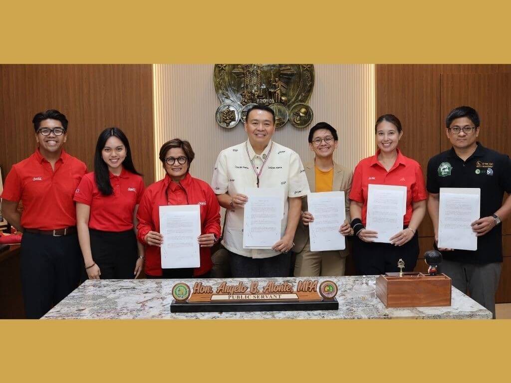 Officials from DILG Laguna, the City Government of Bi&ntilde;an, Coca-Cola Philippines, and BEST Inc. during the MOU signing for the Tapon to Ipon program. | Contributed photo