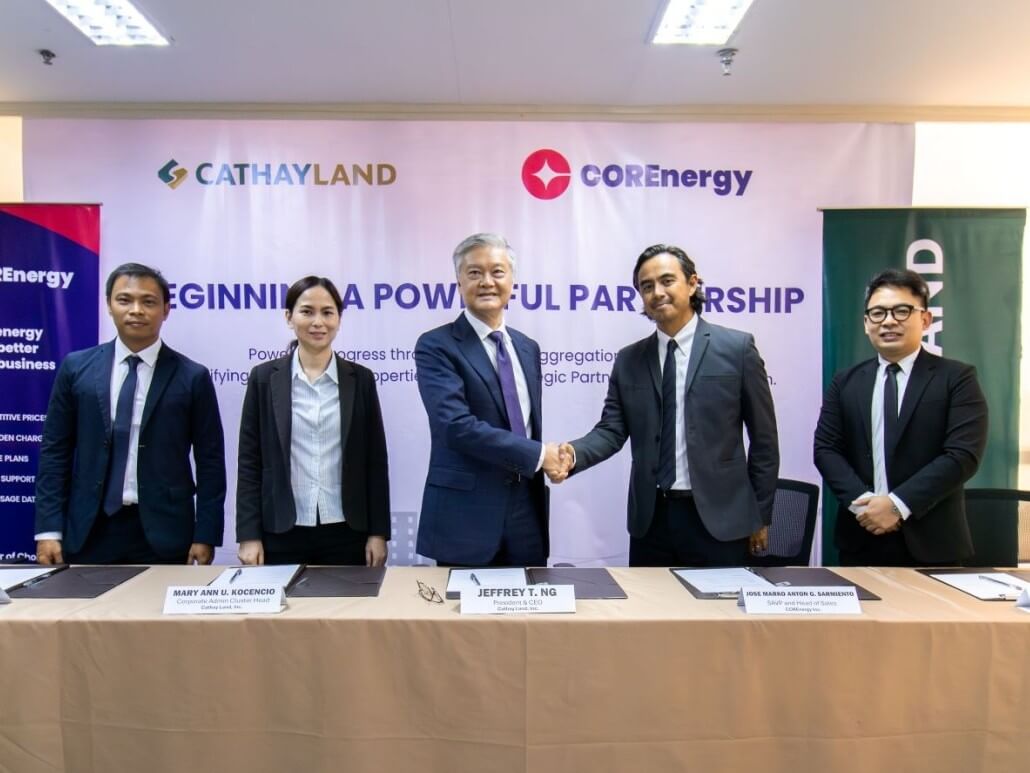 Cathay Land president and CEO Jeffrey T. Ng (center) and VP corporate administration Mary Ann Kocencio (2nd from left) with COREnergy VP and head of operations Marko Sarmiento (4th from the left), head of commercial operations and strategy Michael Lasam (rightmost), and senior sales manager Teodorico Cortinas (leftmost) formally seal the energy partnership.| Contributed photo