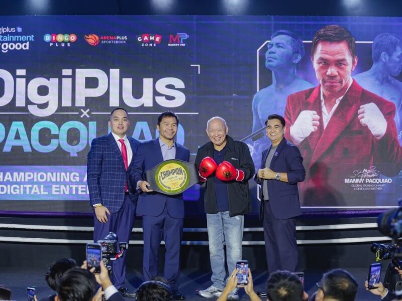 Boxing icon Manny Pacquiao (second from left) joins DigiPlus chair Eusebio Tanco (third from left) and company executives during the unveiling of their partnership, one of the collaborations highlighted under DigiPlus' "Entertainment for Good" framework to expand locally relevant digital entertainment offerings. | Contributed photo