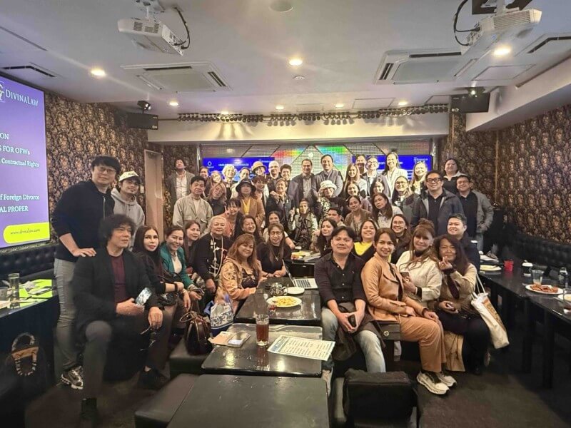 It looked more like one big Filipino reunion than a legal clinic as DivinaLaw lawyers and overseas Filipino workers gathered for a group photo after a day of free legal consultations at a Tokyo karaoke bar./Photo by Miguel R. Camus&nbsp;