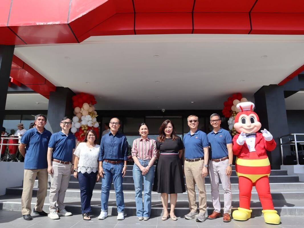 Trade and Industry Secretary Cristina Roque with key officers of Jollibee Foods Corp. at the inauguration of Jollibee's newest commissary in Cebu. | Contributed photo