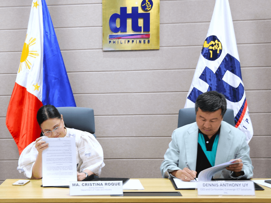 Trade and Industry Acting Secretary Cristina A. Roque and Converge ICT Solutions Inc. CEO and co-founder Dennis Anthony Uy sign the MOU./ Contributed photo