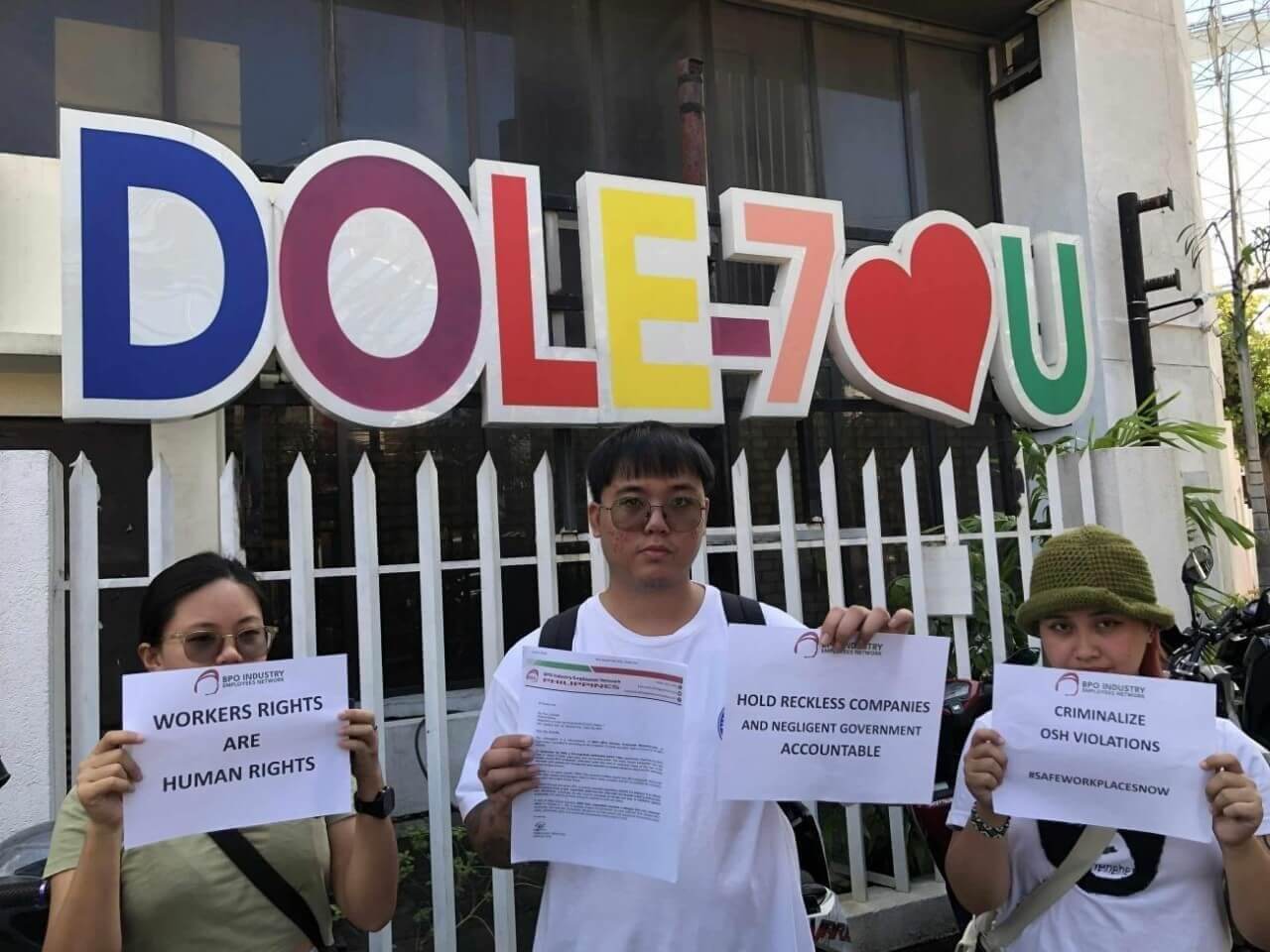 John Kyle Enero, spokesperson of the BIEN-Cebu, shows a copy of the complaint the group filed with the Department of Labor and Employment against 10 BPO companies for allegedly violating labor and occupational safety laws during the strong earthquake on Sept. 30. /Contributed photo 