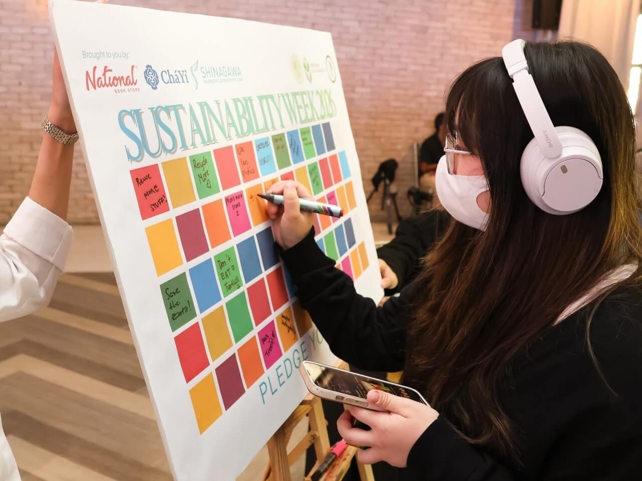 Students transform pledges into action at the Greenprint Wall, where handwritten commitments signal a shift from awareness to everyday accountability, reinforcing how small, personal choices can collectively drive a more sustainable campus culture. | Contributed photo