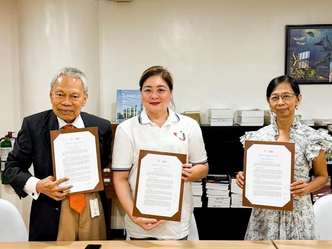 Enderun Colleges president Jun Salipsip (left), GMA Kapuso Foundation EVP/COO Rikki Escudero-Catibog (center), and Enderun head for Social Orientation and Community Development and NSTP Rose Chu (right) during the signing of a partnership agreement aimed at expanding student volunteerism, disaster relief participation, and community engagement initiatives. | Contributed photo