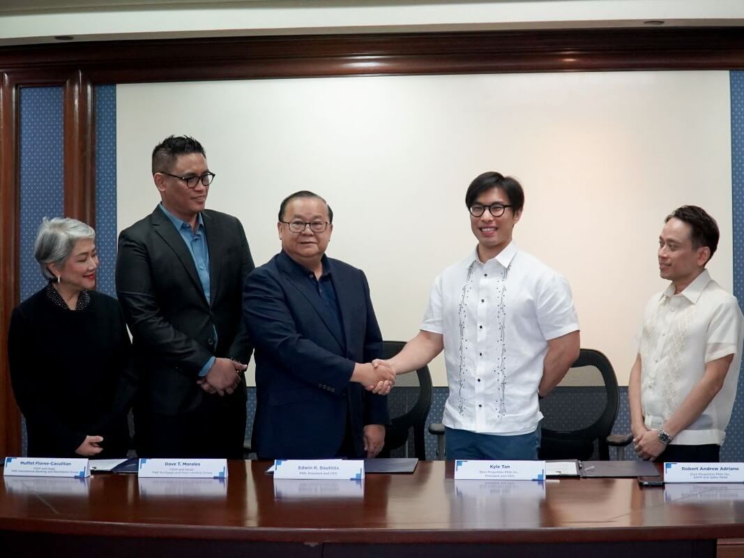 The signing ceremony featured Eton president and CEO Kyle Ellis C. Tan (second from right) and PNB president and CEO Edwin R. Bautista (middle). They were joined by key executives (right to left): Eton head of sales, SAVP Robert Andrew Adriano; head of mortgage and auto lending group, FSVP Dave Morales; and head of the international banking and remittance group, FSVP Muffet Flores-Caculitan. | Contributed photo