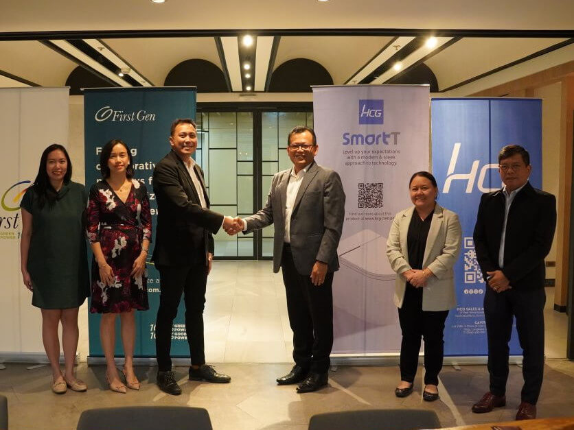 Mark Malabanan (3rd from left), assistant vice president for solar of First Gen, and Eugene Lin (4th from left), senior vice president and officer in charge of HCG Philippines, shake hands after signing the contract between the two companies . Also in photo are (from left) Chloe Kayanan, First Gen senior power marketing manager; Arlene Soriano, First Gen power marketing head; Mornaliza Belardo, HCG Philippines assistant vice president for operations; and Elden Wu, HCG operations manager./ Contributed photo