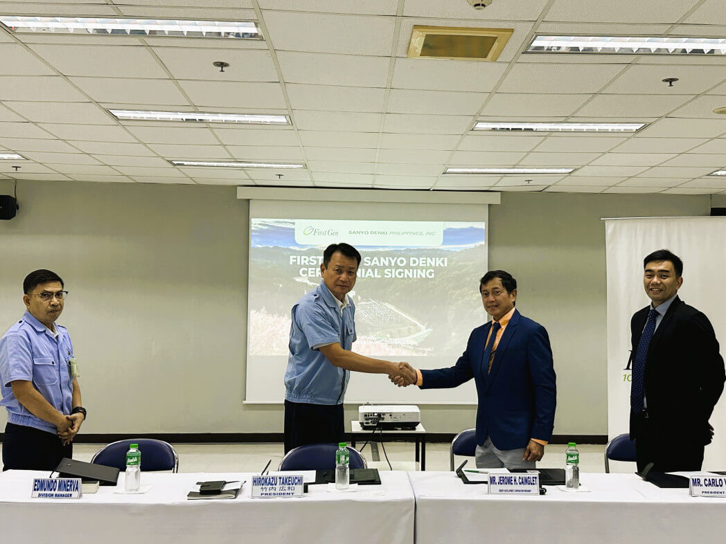 Hirokazu Takeuchi (second from left), president and CEO of Sanyo Denki Philippines, and Jerome H. Cainglet, president and COO of First Gen subsidiary Energy Development Corp., shake hands after signing an agreement for First Gen to supply electricity from an RE source to the manufacturing facilities of Sanyo Denki Philippines at the Subic Technopark. Also in photo are Edmundo Minerva (left), Sanyo Denki Philippines division manager, and Carlo Vega, First Gen chief engagement officer./ Photo from First Gen