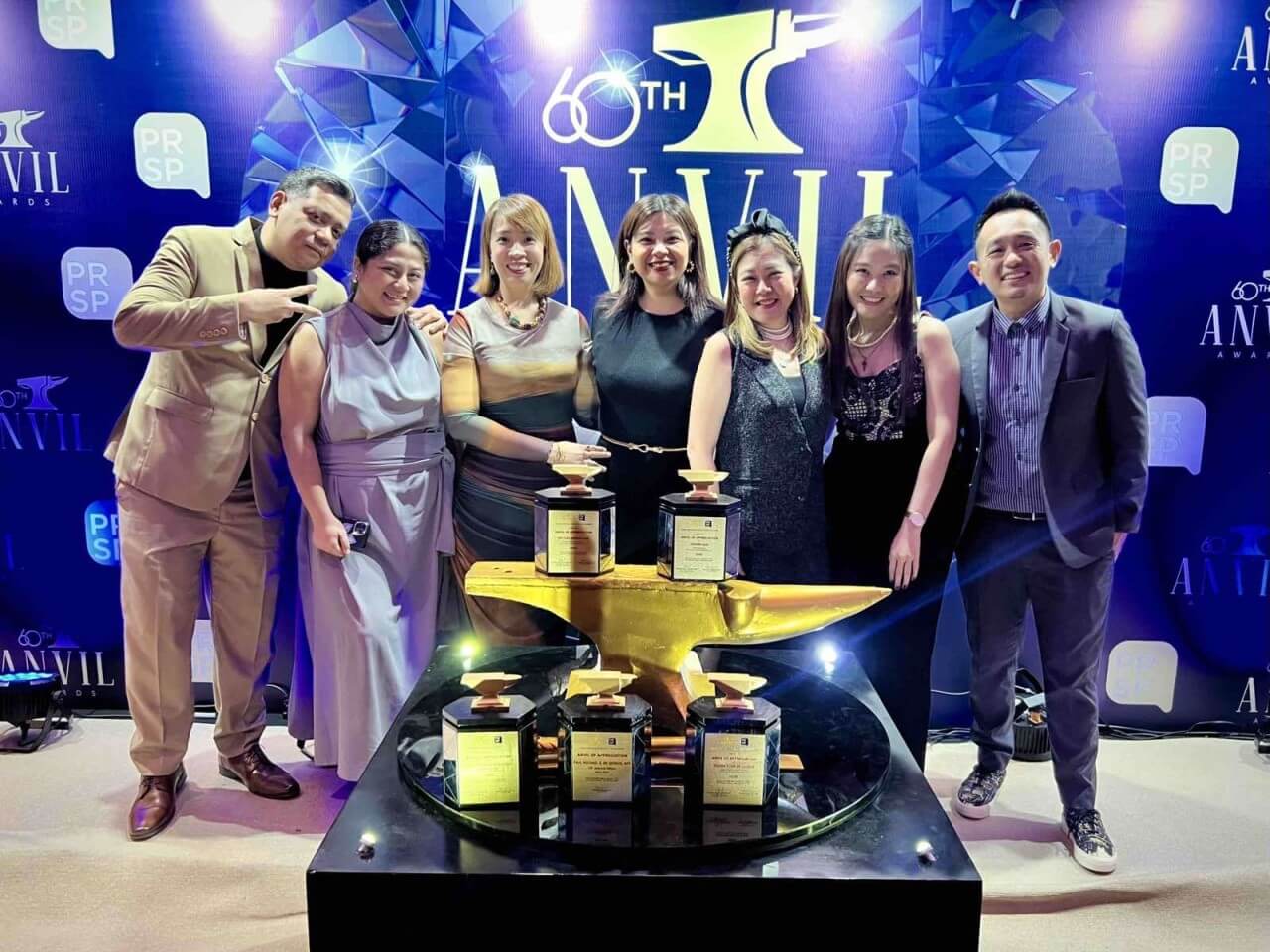 The Full Circle team with its Anvil Awards -- a recognition of quality work by its industry peers./Contributed photo