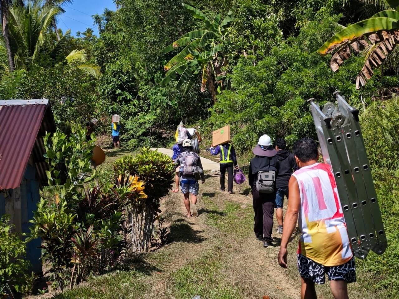 Getting equipment to remote sites involves hours of hiking and boat travel, often under difficult weather conditions. | Contributed photo