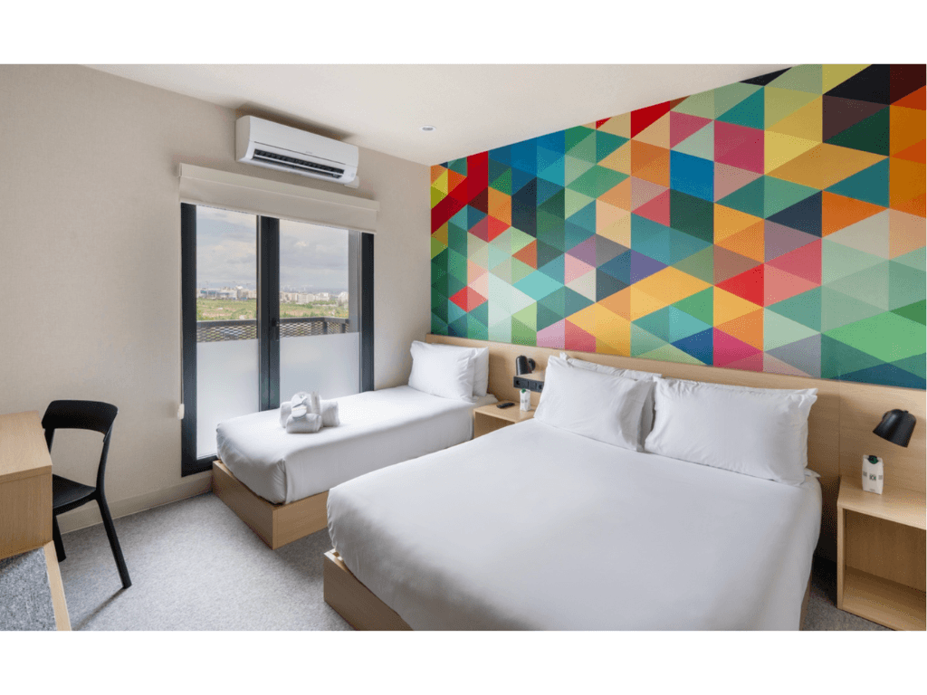 Hotel101&rsquo;s signature 21-sqm HappyRoom is equipped with a practical kitchenette featuring microwave, refrigerator and kettle, luggage rack, 55&rdquo; TV, free high-speed internet, work desk, modern bidet toilet, strong water pressure, and premium Emma Sleep mattresses./Contributed photo