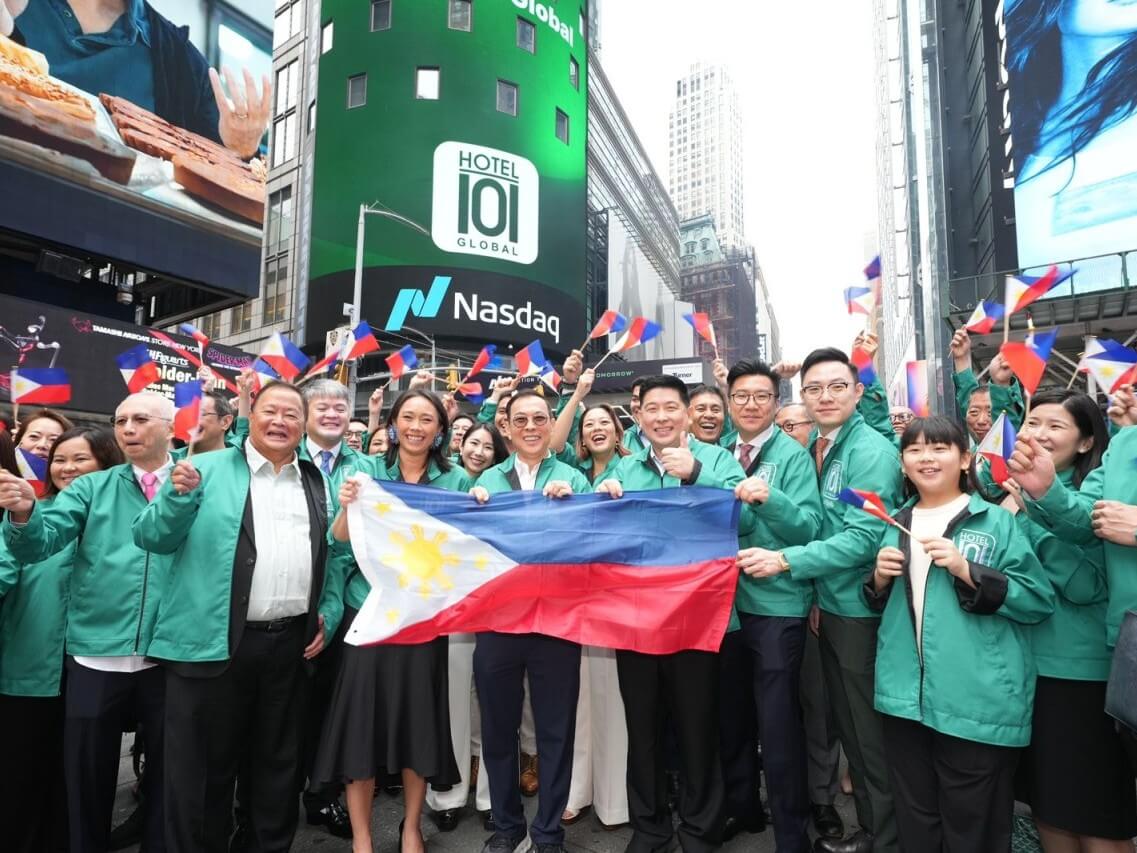 The Hotel101-JVSpac team, led by Edgar "Injap" Sia II and Tony Tancaktiong display the Philippine flag outside the Nasdaq headquarters in Times Square, New York on Friday, July 27, 2025./Contributed Photo