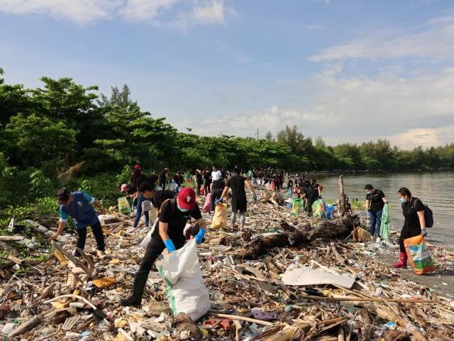 ING Hubs Philippines employees in action—participating in coastal cleanup efforts—demonstrating the organization’s commitment to environmental stewardship and community development. | Contributed photo