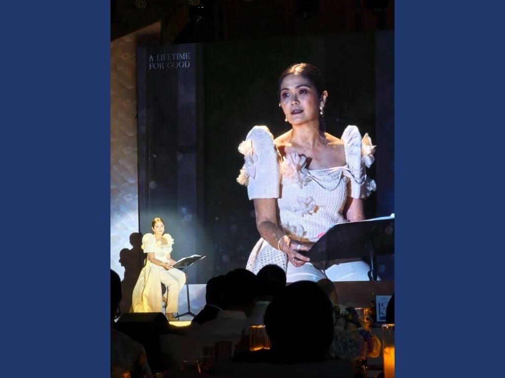  Gae Martinez, InLife chief marketing officer, reads an excerpt from InLife's commemorative book. |  Photo by Vanessa B. Hidalgo