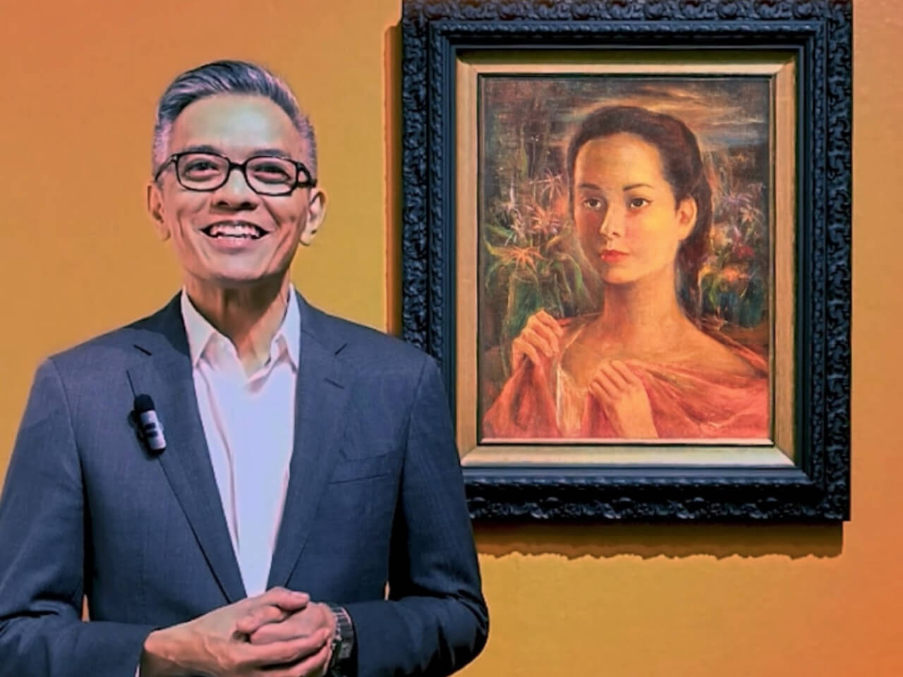 Richie takes to the camera: behind him is Anita Magsaysay-Ho's "Portrait of a Young Woman" that sold for a world record price.
