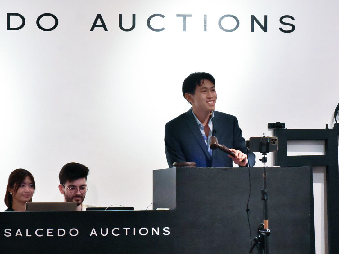 Passing the torch: Joaquin Lerma, gavel in hand, presides over an auction.
