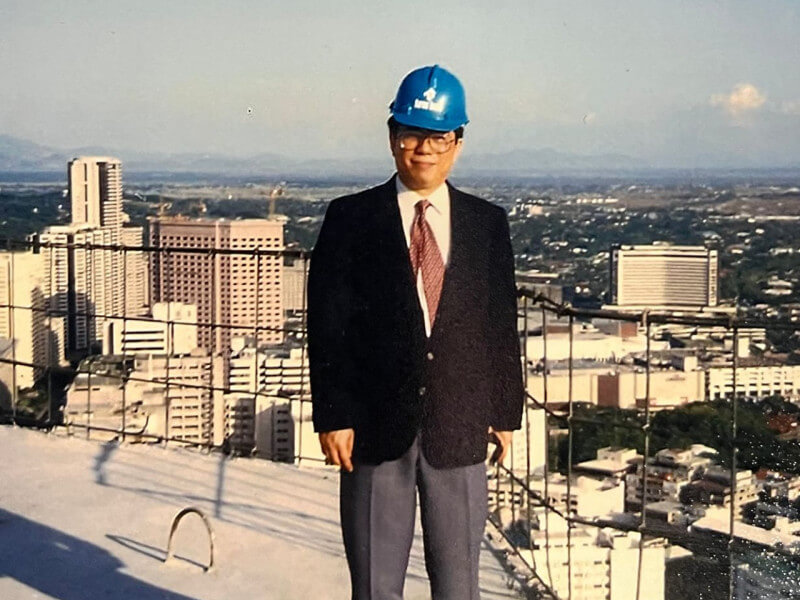 Carlos "Charlie" Rufino at the job site high above the Makati CBD. / Photo from NEO (Click to view the full image)