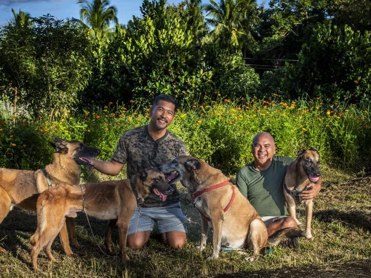 Janolino (right) and San Pedro with Shadow, Carmella, Gian and Cooper, their adopted military dogs./contributed photo